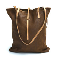 cognac leather tote bag with simple tab closure