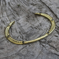 adjustable brass bracelet with black stone detail