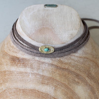 grey leather wrap necklace with brass and turquoise detail