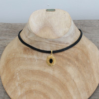 Black leather with gold plated pendant featuring black agate stone