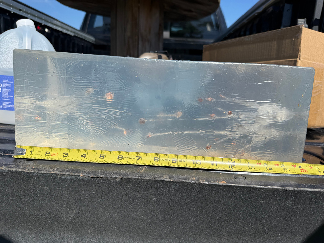 Gel comparison showing bare gel (bullet that entered from the left) against bullets as fired through denim (incoming from the right).  The effective change in performance is minimal, almost completely unaffected by the denim/fleece jacket.