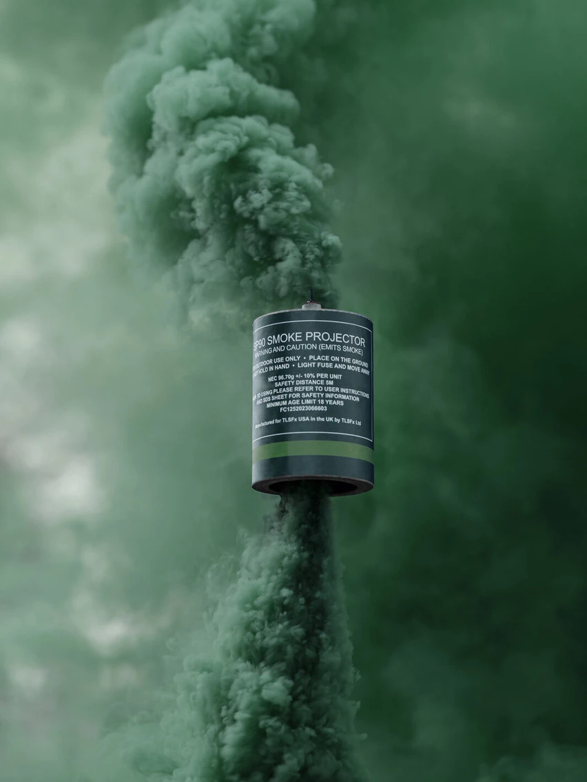 SP90 smoke grenade in green smoke