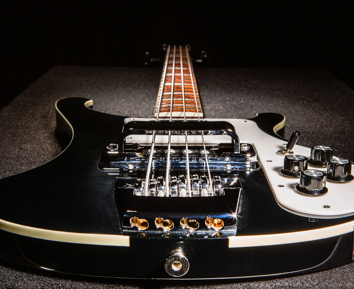 Strings anchored over the saddles of a bass.