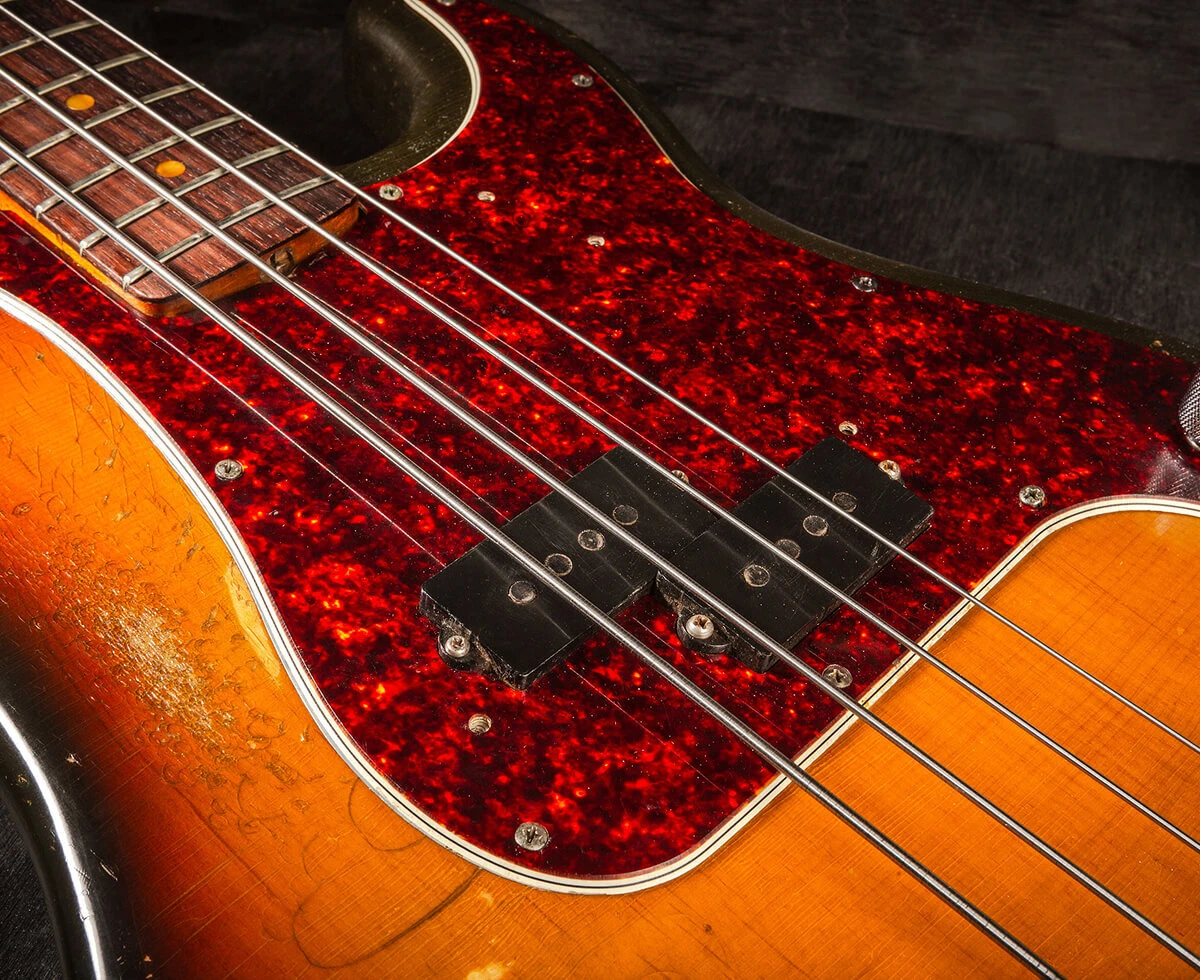 Bass strings running from the fingerboard across the pickups.