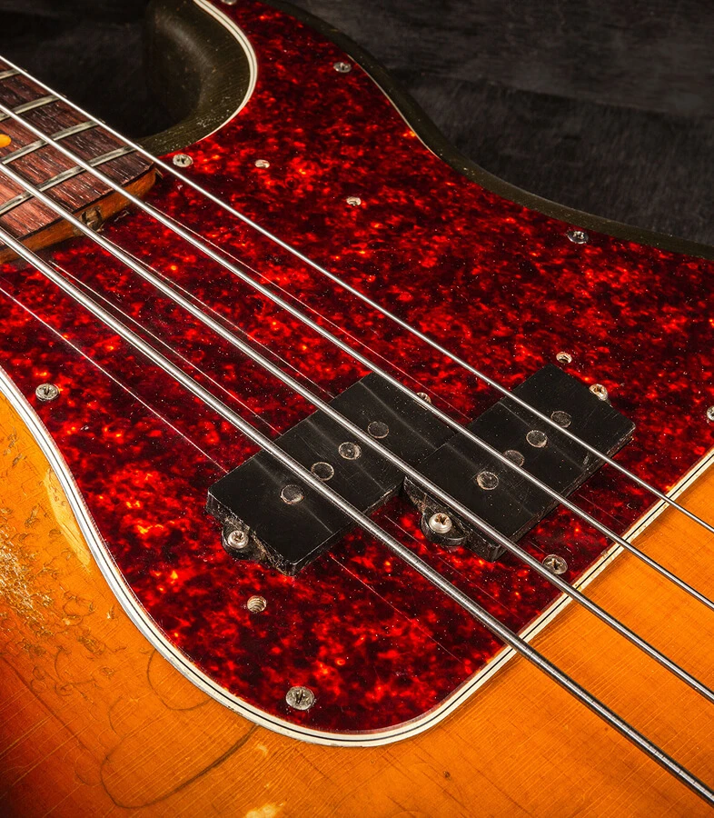 Bass strings running from the fingerboard across the pickups.