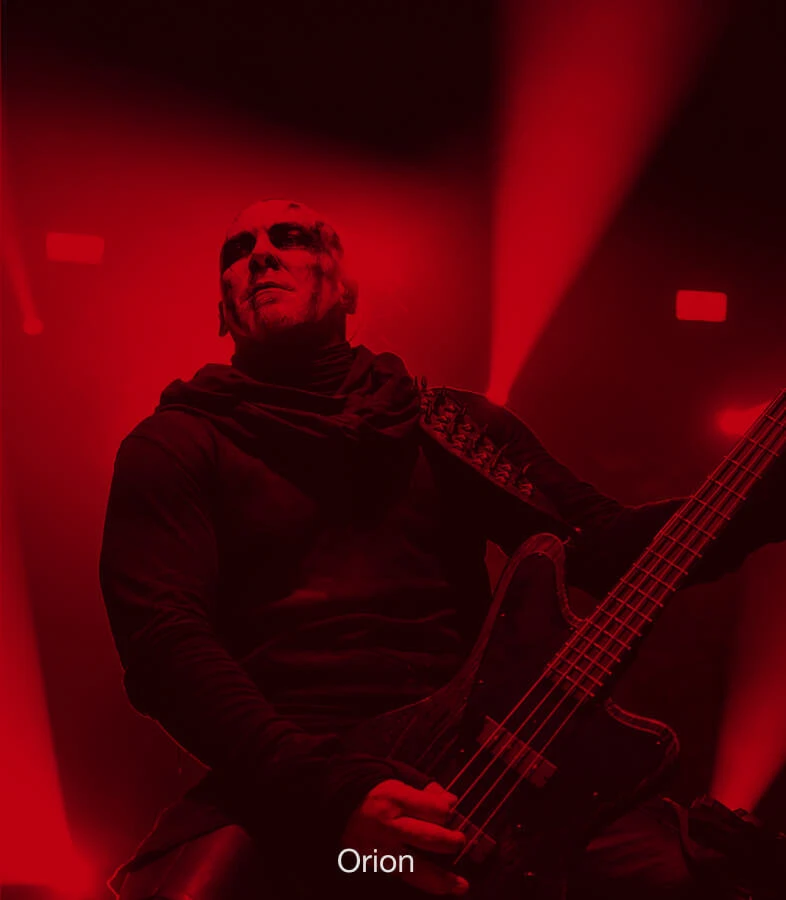 Bassist Orion performing live with a bass.