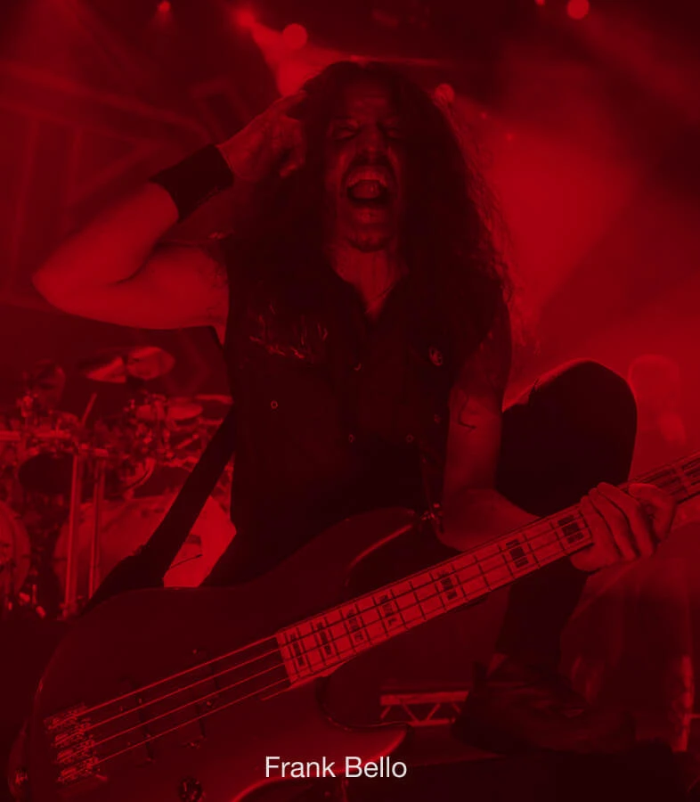 Bassist Frank Bello performing live with a bass.