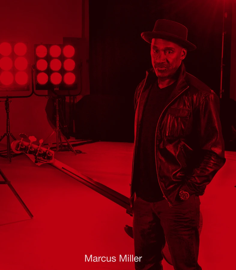 Bassist Marcus Miller holding a bass.