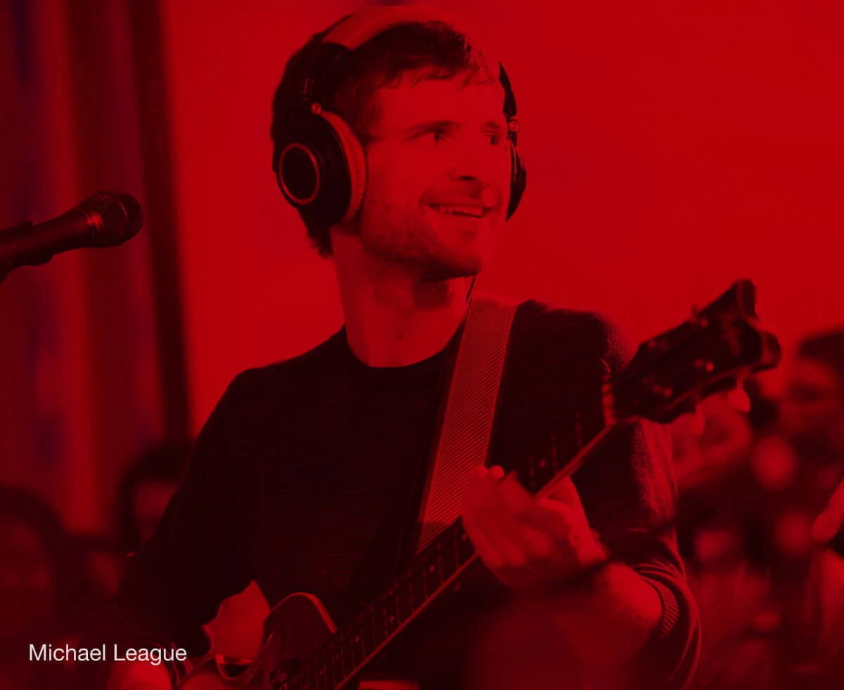 Bassist Michael League performing with a bass.