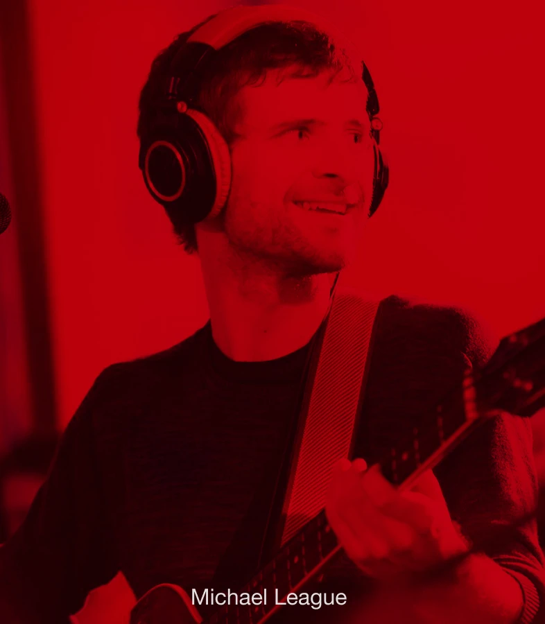 Bassist Michael League performing with a bass.