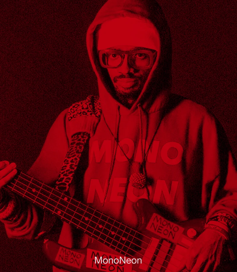 Bassist MonoNeon performing with a bass