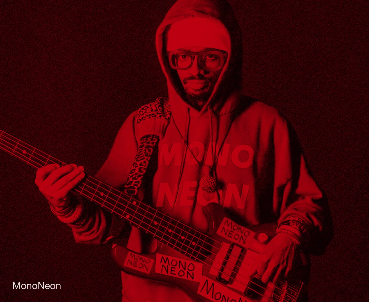 Bassist MonoNeon performing with a bass.