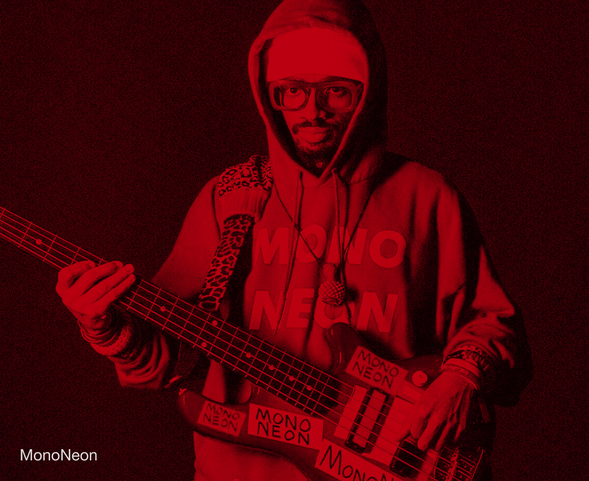 Bassist MonoNeon performing with a bass.