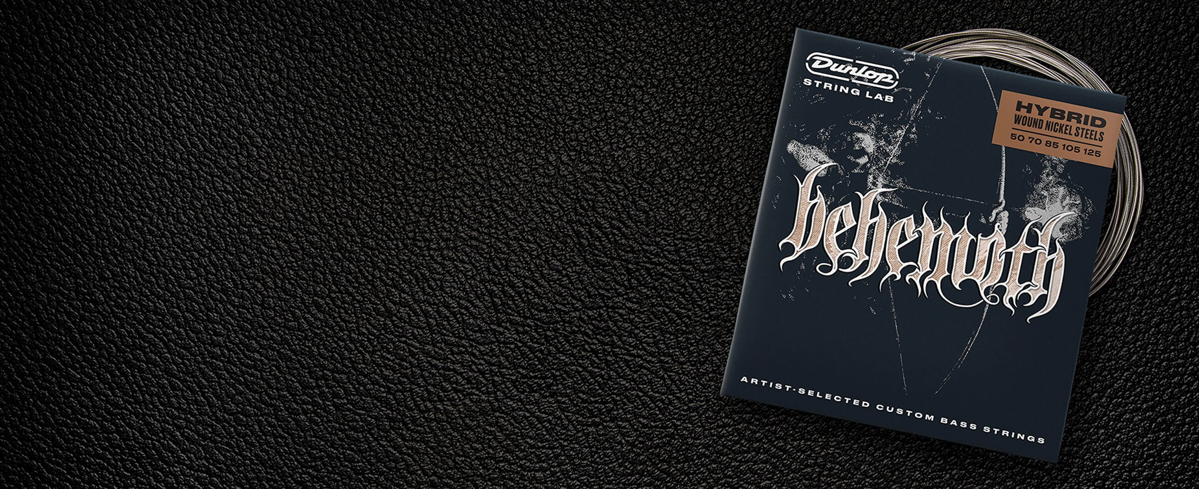 A Dunlop bass string package with the coiled strings fanned out beside it.