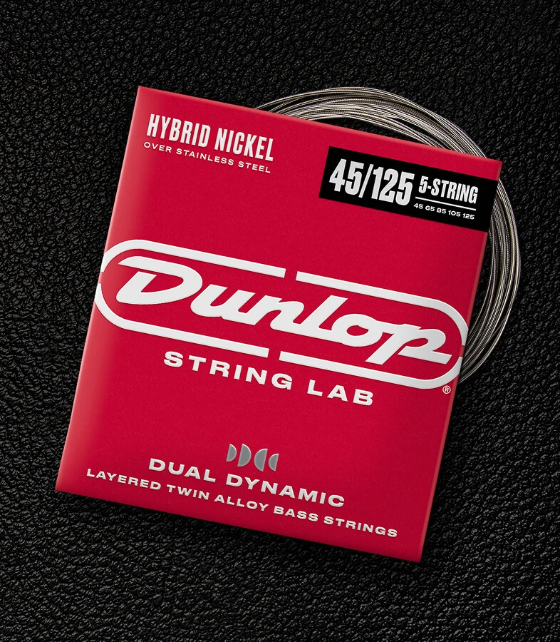 A Dunlop bass string package with the coiled strings fanned out beside it.