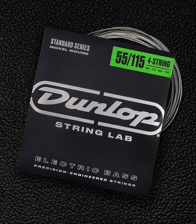 A Dunlop bass string package with the coiled strings fanned out beside it.