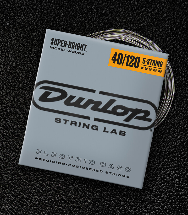 A Dunlop bass string package with the coiled strings fanned out beside it.