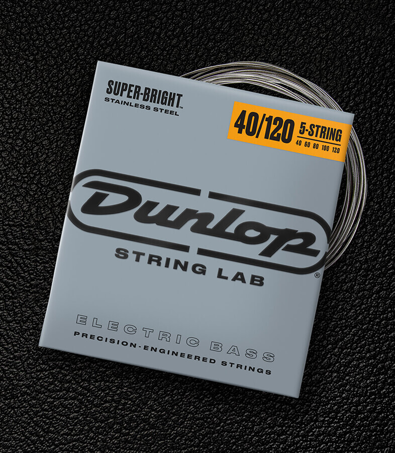 A Dunlop bass string package with the coiled strings fanned out beside it.