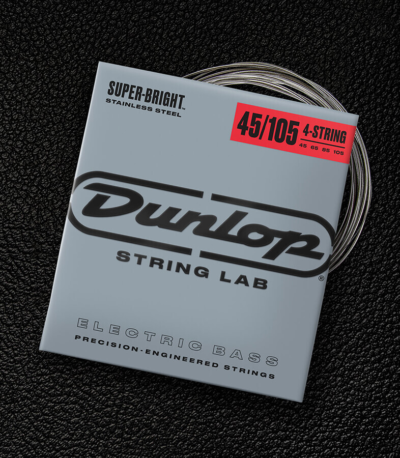 A Dunlop bass string package with the coiled strings fanned out beside it.