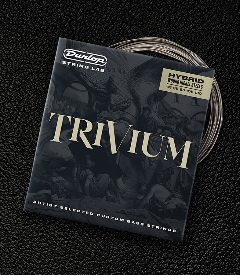 A Dunlop bass string package with the coiled strings fanned out beside it.