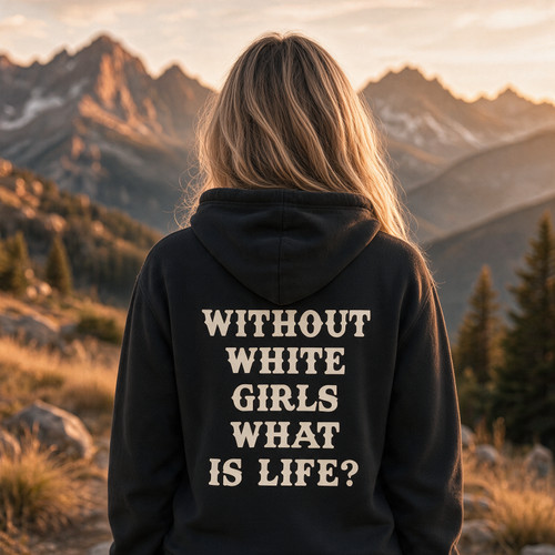 Woman wearing a black “Without White Girls What Is Life” graphic T-shirt outdoors