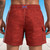 Man wearing burgundy Rebel Flag cargo swim trunks, front view