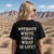 Back view of woman wearing a black "Without White Girls What Is Life" graphic T-shirt
