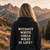 Woman wearing a black “Without White Girls What Is Life” graphic T-shirt outdoors