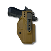 Coyote brown Fat Guy Holster with Ulticlip attachment on a handgun, designed for secure deep concealment carry. Coyote brown Fat Guy Holster with Ulticlip attachment on a handgun, designed for secure deep concealment carry.