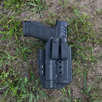Black carbon fiber pattern Kydex IWB holster with dual soft loops and concealment wing, holding a Walther PDP pistol