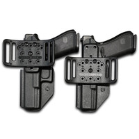 Two Low Rider OWB holsters with belt slide attachments, each holding a pistol, displayed side-by-side.