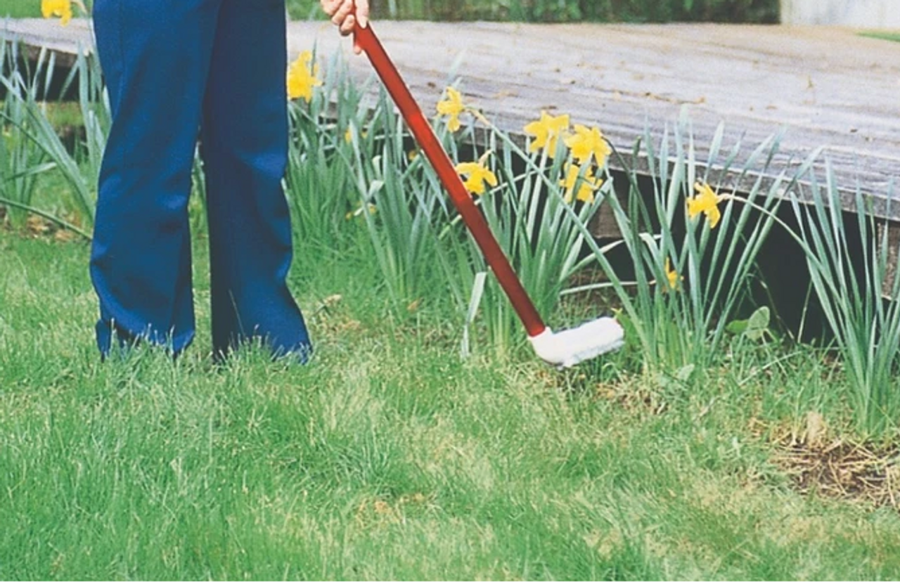 Smucker Red Weeder Handheld Wiper Kit being Used