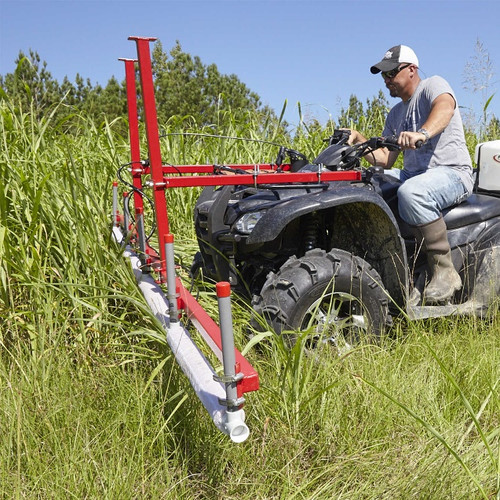 Man using Smucker 10' Weed Wiper ATV Mount | WWTCATV10 attached to ATV Man using Smucker 10' Weed Wiper ATV Mount | WWTCATV10 attached to ATV