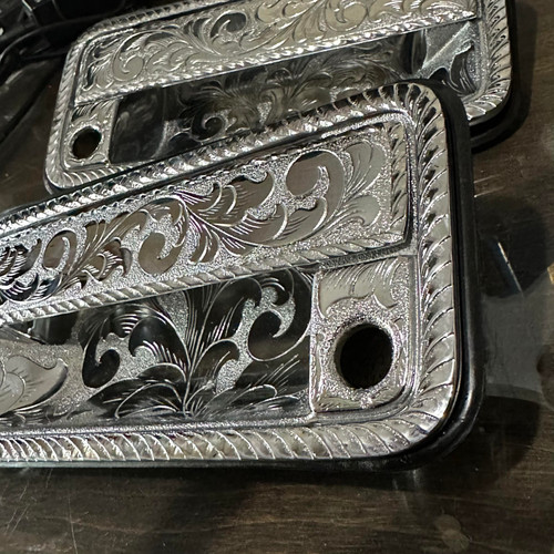 Pair of Billet Aluminum Hand Engraved Door Handles.<br>
Fits 1988-1998 GMC & Chevy Trucks/SUV’s <br>
Each piece is hand engraved and has a unique design variation.<br>
No two pieces are the exactly alike.<br>