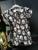 Alternative baby romper with black and white skull print