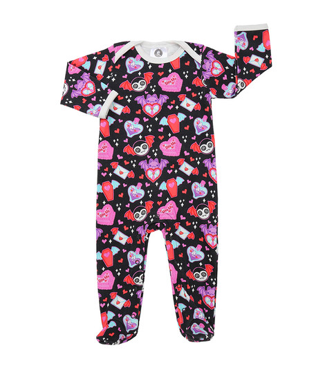 Baby sleepsuit styled on a clean, neutral background, featuring a Valentine’s-themed all-over print with cute vampires, “bite me” heart-shaped cakes, and illustrated love letters. Made from soft 100% cotton with popper fastenings, shown laid flat to highlight the detailed print and comfortable fit.