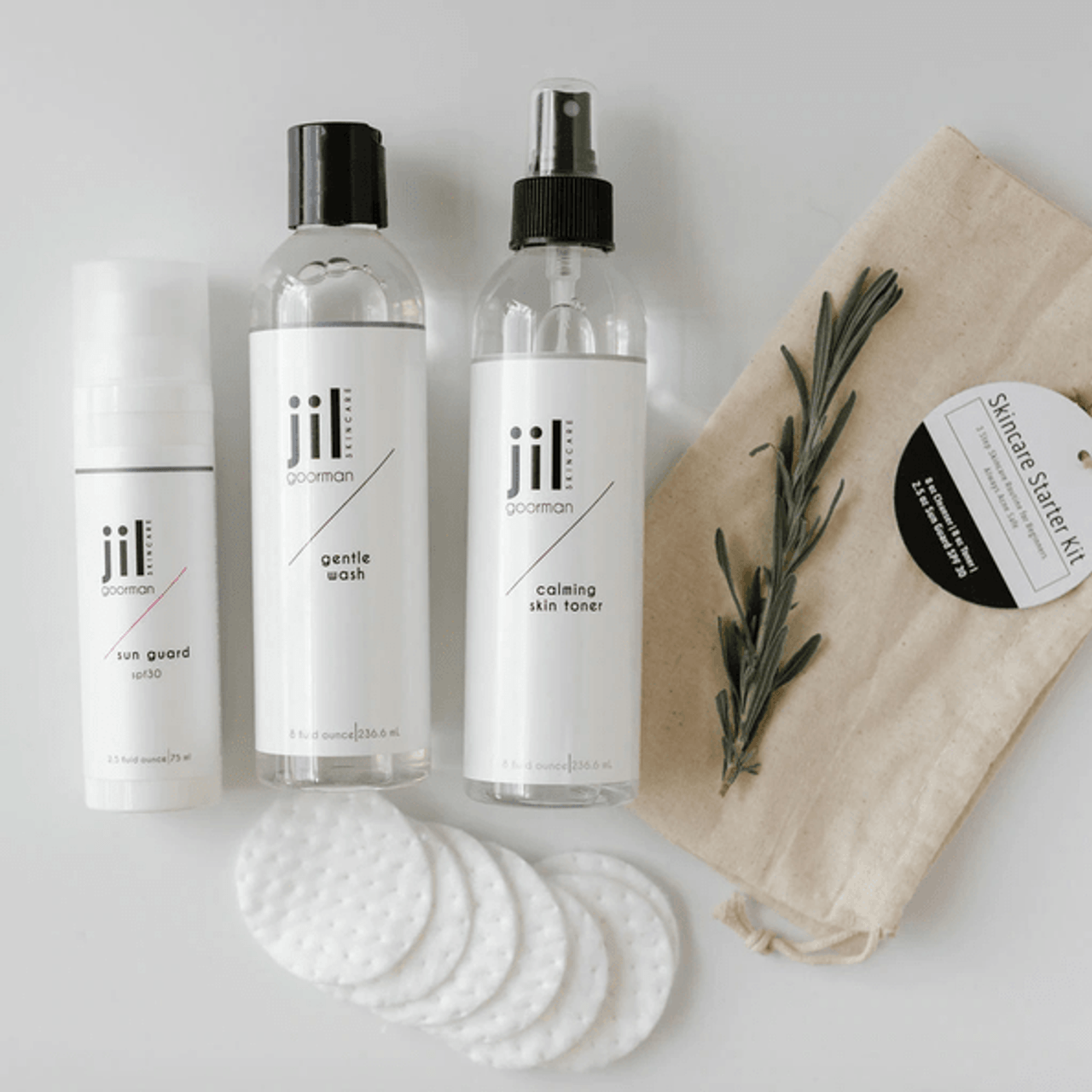 three products with cotton pads and a small cotton bag 