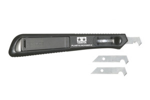 This Plastic Scriber II is ideal for cutting thick plastic boards, adding detail to plastic scale models, and opening holes to modify Mini 4WD bodies. The Tamiya original tungsten steel narrow blade enables you easy access to hard-to-reach places. The blade can be safely retracted inside when not in use. Two interchangeable spare blades are included.