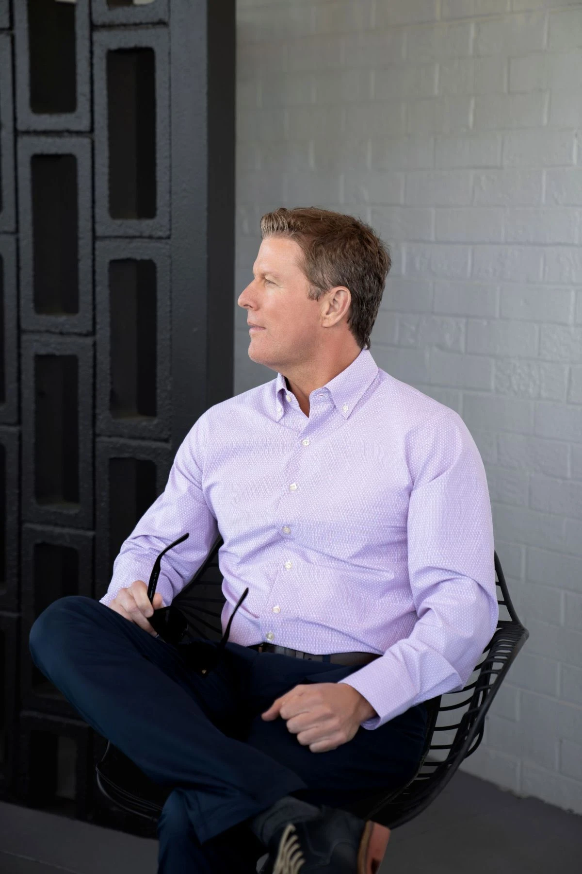 Man wearing a lavender Horn Legend sport shirt