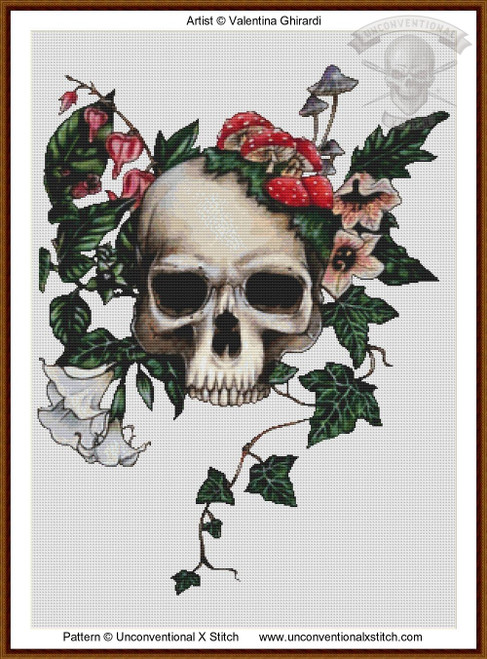 cross stitch pattern of a skull with vines and flowers