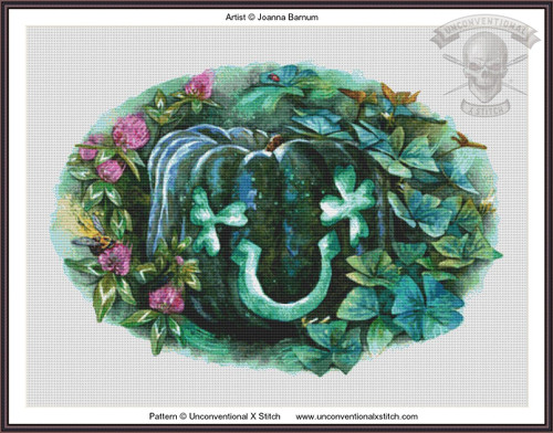 a cross-stitch pattern of a pumpkin in shades of teal and green, adorned with leaves and flowers. The pumpkin is surrounded by a circular arrangement of green leaves and pink flowers, creating a lush, natural border. There are soft shadows and highlights that give the pumpkin a three-dimensional appearance. A ladybug and dragonfly are discreetly incorporated into the foliage, adding to the natural theme. 