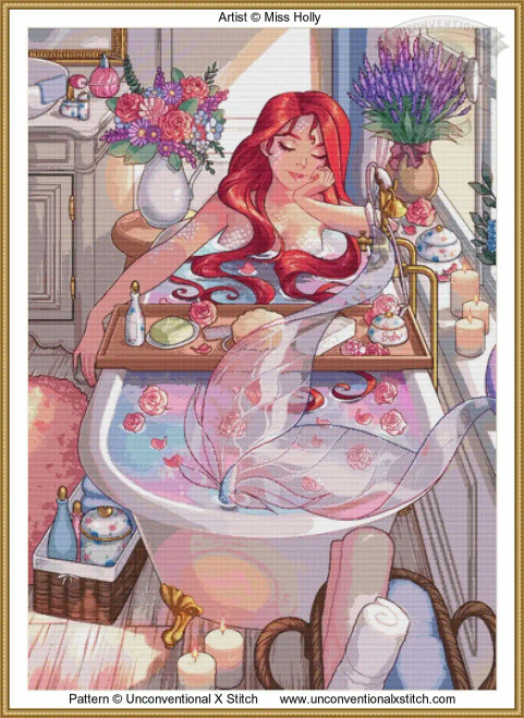 A cross-stitch pattern of a serene bathroom scene with a mermaid relaxing in a bathtub. Her long red hair cascades over the edge, and her eyes are closed in a peaceful expression. The bathtub is filled with colourful bathwater, flowers, and her tail fins sticking out the end. Around the tub, there are various elements creating an inviting atmosphere: on a wooden tray across the tub are a soap bar, a bottle, and a jar. In the background, a vase holds a vibrant bouquet of purple and pink flowers. On the window ledge, a pot of purple lavender and several lit candles add to the tranquil ambiance. A wicker basket on the floor holds towels and blue bottles, while a soft pink rug enhances the cosy setting. The wood flooring and gentle lighting add warmth to the room.
