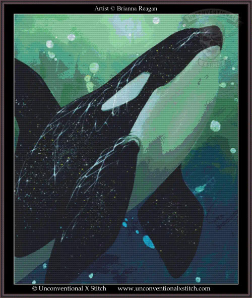 cross stitch pattern of  a killer whale swimming underwater amidst bubbles