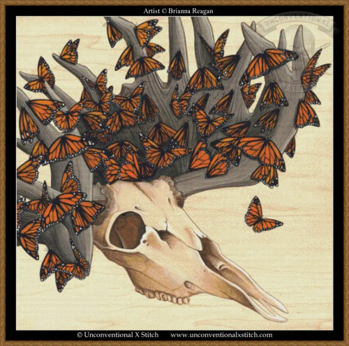 cross stitch pattern of a stag skull with antlers covered in Monarch butterflies