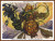 Cross-stitch pattern of a goblin that features a beetle steed pumpkin-like face with glowing yellow eyes and an exaggerated grin. The arms are elongated and exaggerated, with leafy, textured extensions. The background is a swirl of warm colors, predominantly yellow and orange, suggesting a swirling motion. The creature is adorned with elaborate decorations, including a crown-like structure on its head, and a delicate, wing-like structure below. The composition has an animated and dynamic feel, with various swirls and intricate patterns in the backdrop enhancing the fantastical theme.