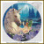 A fantasy cross stitch pattern featuring a mythical unicorn and a fairy amidst a dreamy, mystical landscape. The unicorn, positioned on the left, has a glowing white mane adorned with small purple flowers. Its large, gentle eye and golden horn are prominent features. Beside the unicorn sits a small fairy with light orange hair, green translucent wings, and a glowing wand. She is perched on a large, purple flower, gazing affectionately at the unicorn. In the background, there's an enchanting scene with a castle silhouette and evergreen trees. A waterfall cascades into a serene body of water, bordered by vibrant flora.