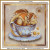 cross stitch pattern of a chamomile dragon resting in a blue teacup with chamomile flowers nearby