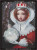 Cross stitch pattern of a royal Queen with red hair, donning an intricate lace-trimmed space helmet and wearing a patterned, ornate red and white outfit with lace details reminiscent of a historical gown. Her visage is ethereal, with large, expressive eyes and full lips. She holds a round object, resembling the moon or a celestial globe, with her gloved hands. The background is a cosmic scene, depicting dark space with specks resembling stars and ethereal drops that float around, contributing to the fantastical atmosphere.