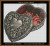 cross stitch pattern of a heart shaped metal box with floral engravings open to reveal a realistic human heart inside