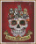 Cross-stitch pattern of  a stylized sugar skull adorned with artistic details in a Day of the Dead theme. Positioned atop the skull are a variety of cartoonish dogs, each with distinct characteristics and expressions, evoking a playful and whimsical mood. The background is a deep, textured red, enhancing the focal elements with its contrast. The sugar skull is intricately decorated with swirling lines and colourful accents, including marigold flower-like embellishments around the eyes. At the base of the skull is a banner that reads "DIA DE LOS PERROS" in decorative black lettering. The entire composition is vibrant and festive, capturing a celebratory feel.